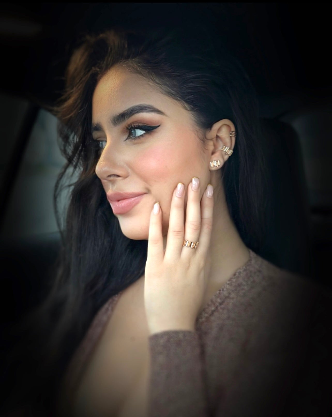 Close up image of the full LAVERTUE fine jewelry collection, worn by a feminine model, inspired by a timeless fable about patience and healing. Designed in Montreal, available in solid yellow gold and 24k vermeil, with zircon or diamond stones.
