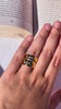close up video of DOLCE rings worn by a hand model reading a book in montreal by the pool in summer.
