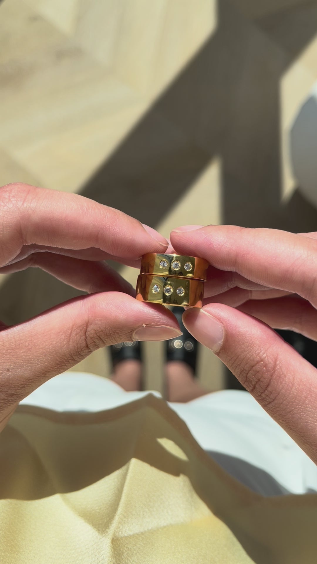 video Showcasing DOLCE, both in 6mm and 8mm, Inspired by a poetic ode to farniente, features 3 stones like ellipses, a tribute to slowness, pleasure, and elegant pause. Made in Montreal in solid yellow gold (10k,14k,18k) and vermeil 24k.